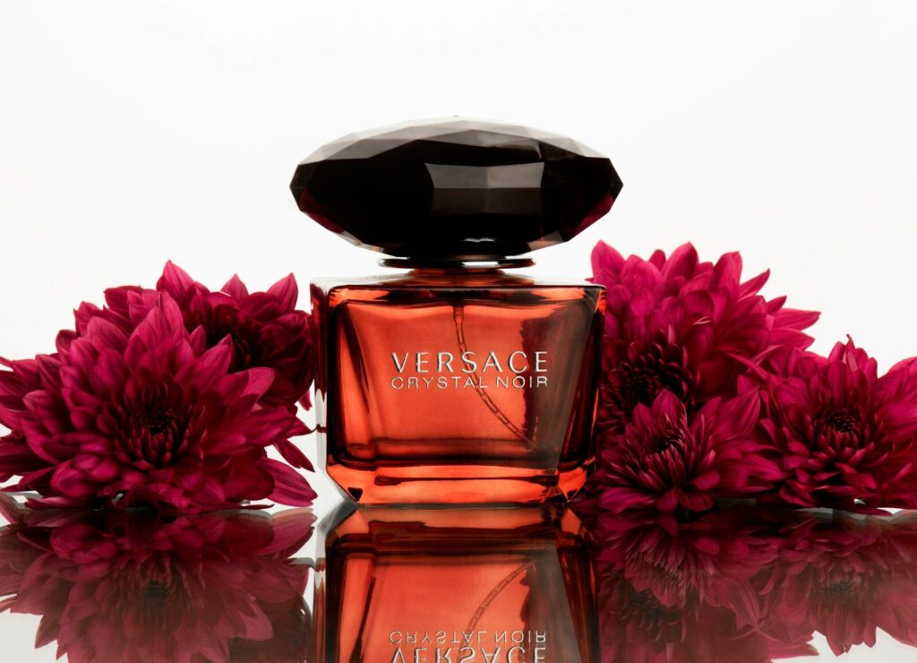 a bottle of perfume sitting on top of a table